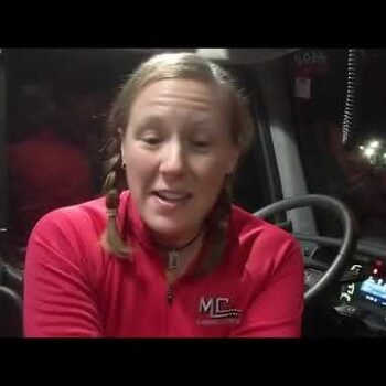 Female truck driver in cab talking about her career