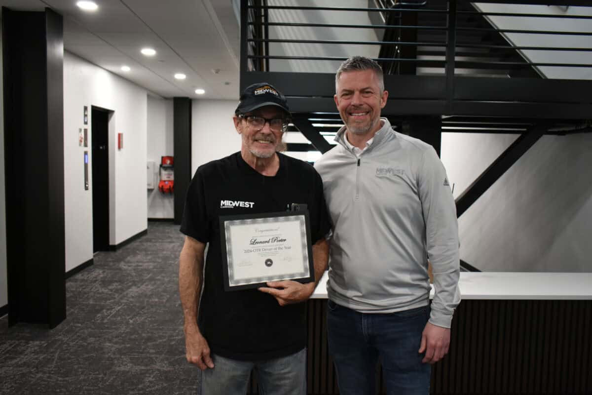 Truck driver honored with awards for service milestones and exceptional mentorship.