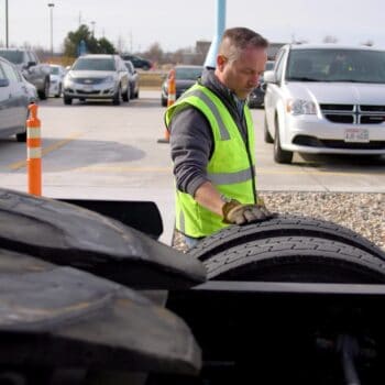 Driver inspecting truck