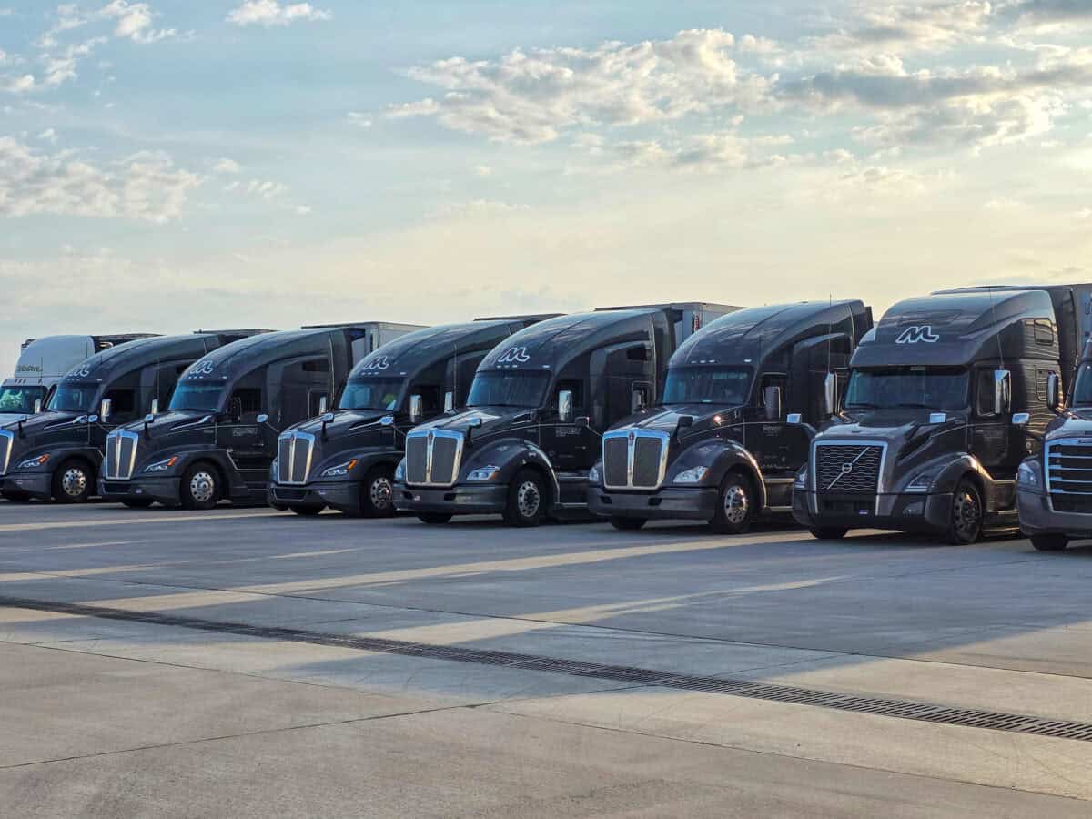 A line of Midwest Carriers trucked parked at the headquarters