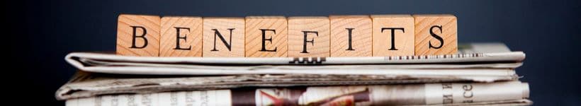 Wood blocks that spell out the word "benefits"